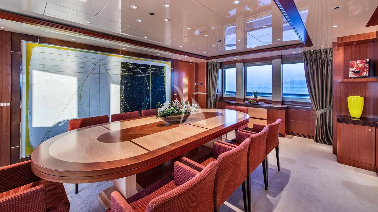 a room with a table chairs and a large window aboard RARE FIND Yacht for Charter