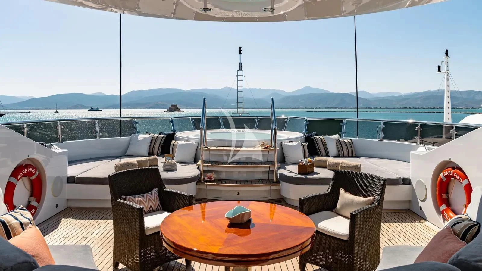 a boat with a table and chairs aboard RARE FIND Yacht for Charter