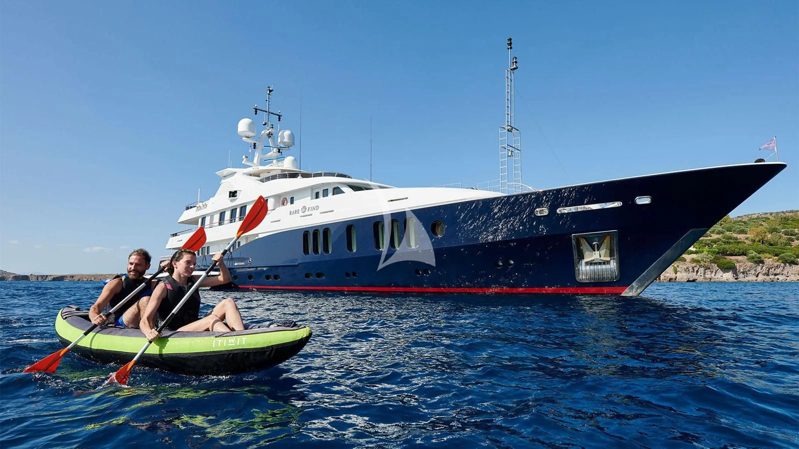 a couple of people in a boat aboard RARE FIND Yacht for Charter