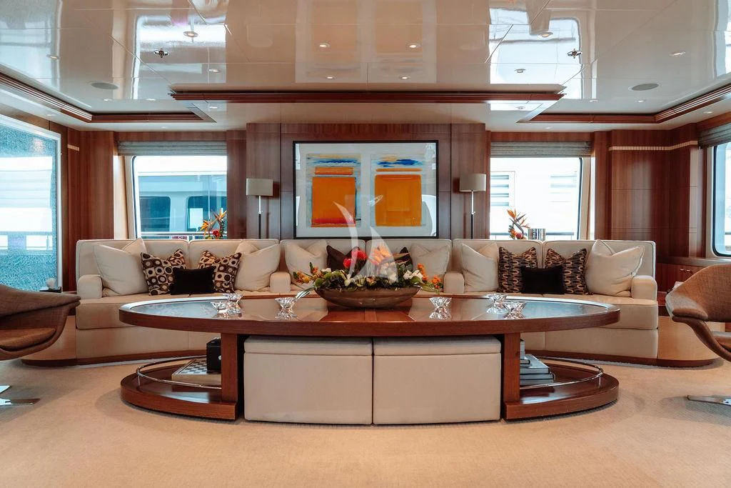 a living room with a large fireplace aboard RARE FIND Yacht for Charter