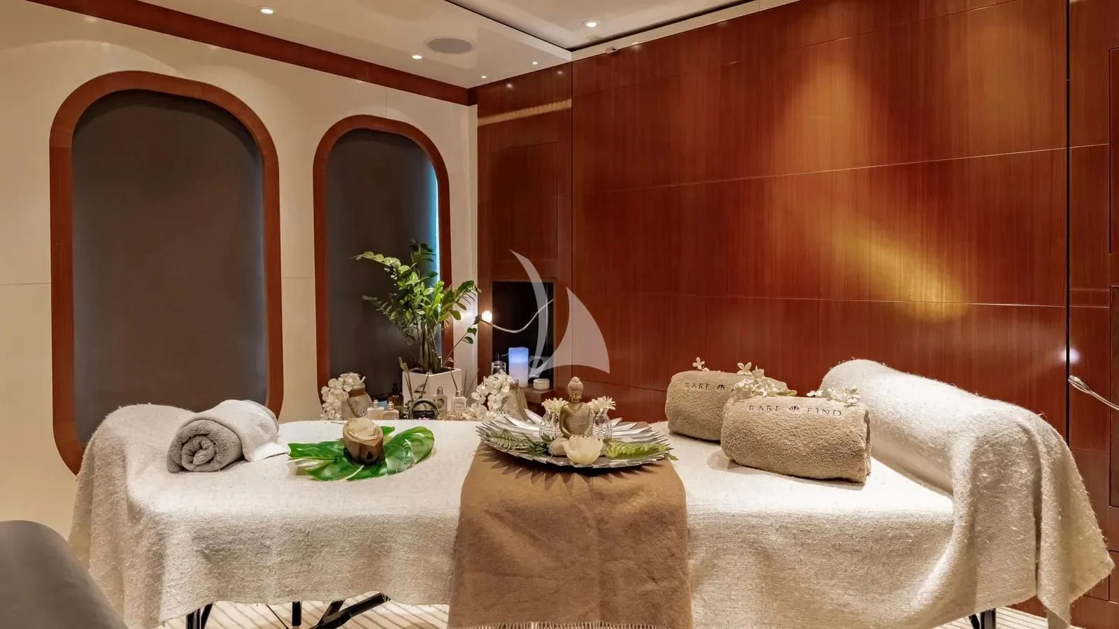 a room with a bed and a mirror aboard RARE FIND Yacht for Charter