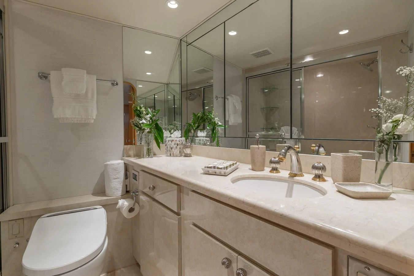 a bathroom with a large mirror aboard IMPULSE Yacht for Sale