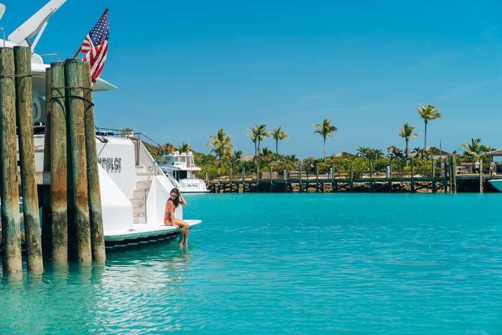 a person on a surfboard in the water aboard IMPULSE Yacht for Sale