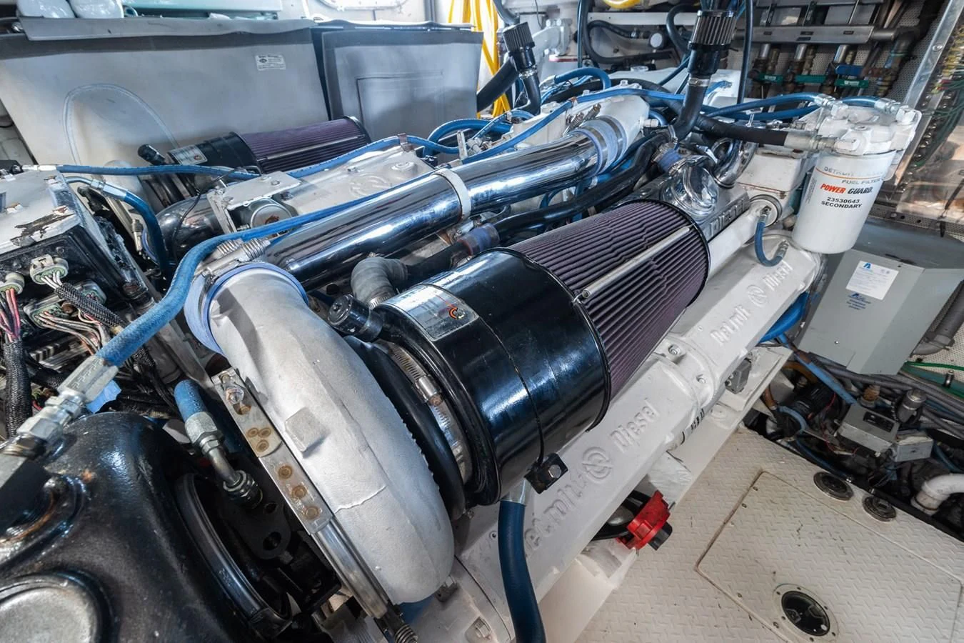 a car engine with a blue car aboard IMPULSE Yacht for Sale