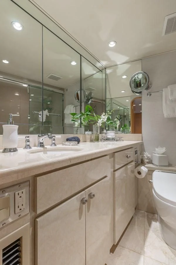 a bathroom with a large mirror aboard IMPULSE Yacht for Sale