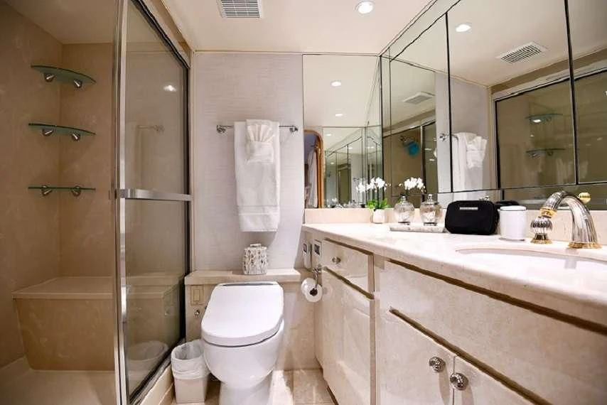 a bathroom with a glass shower aboard IMPULSE Yacht for Sale