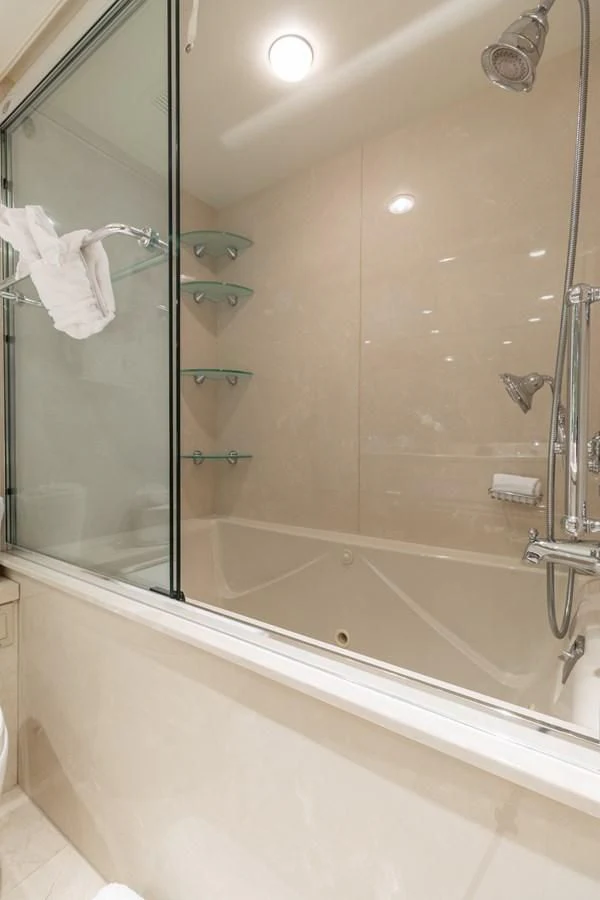 a bathroom with a glass shower aboard IMPULSE Yacht for Sale
