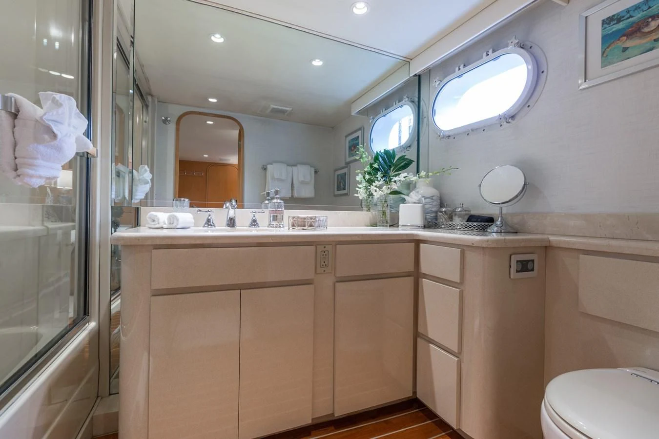a bathroom with a large mirror aboard IMPULSE Yacht for Sale