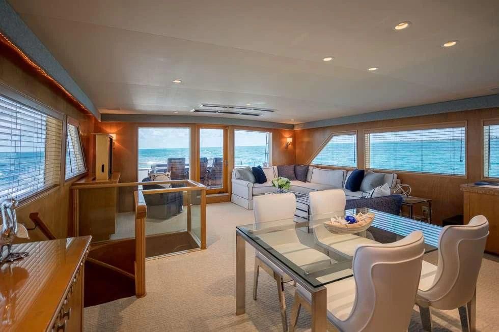 a living room with a large window aboard IMPULSE Yacht for Sale