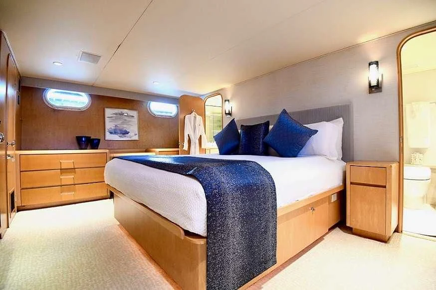 a bed in a room aboard IMPULSE Yacht for Sale