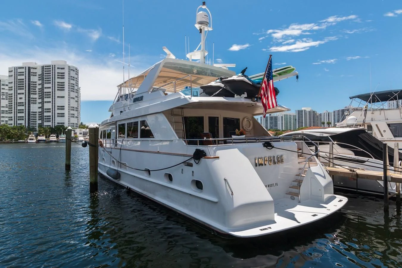 a boat docked at a pier aboard IMPULSE Yacht for Sale