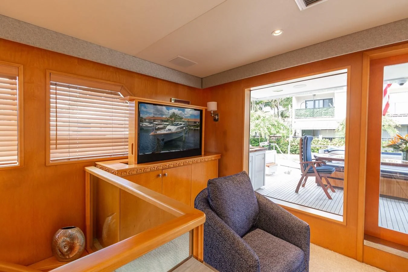 a living room with a tv aboard IMPULSE Yacht for Sale