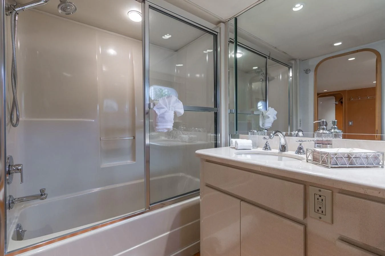 a bathroom with a large mirror aboard IMPULSE Yacht for Sale
