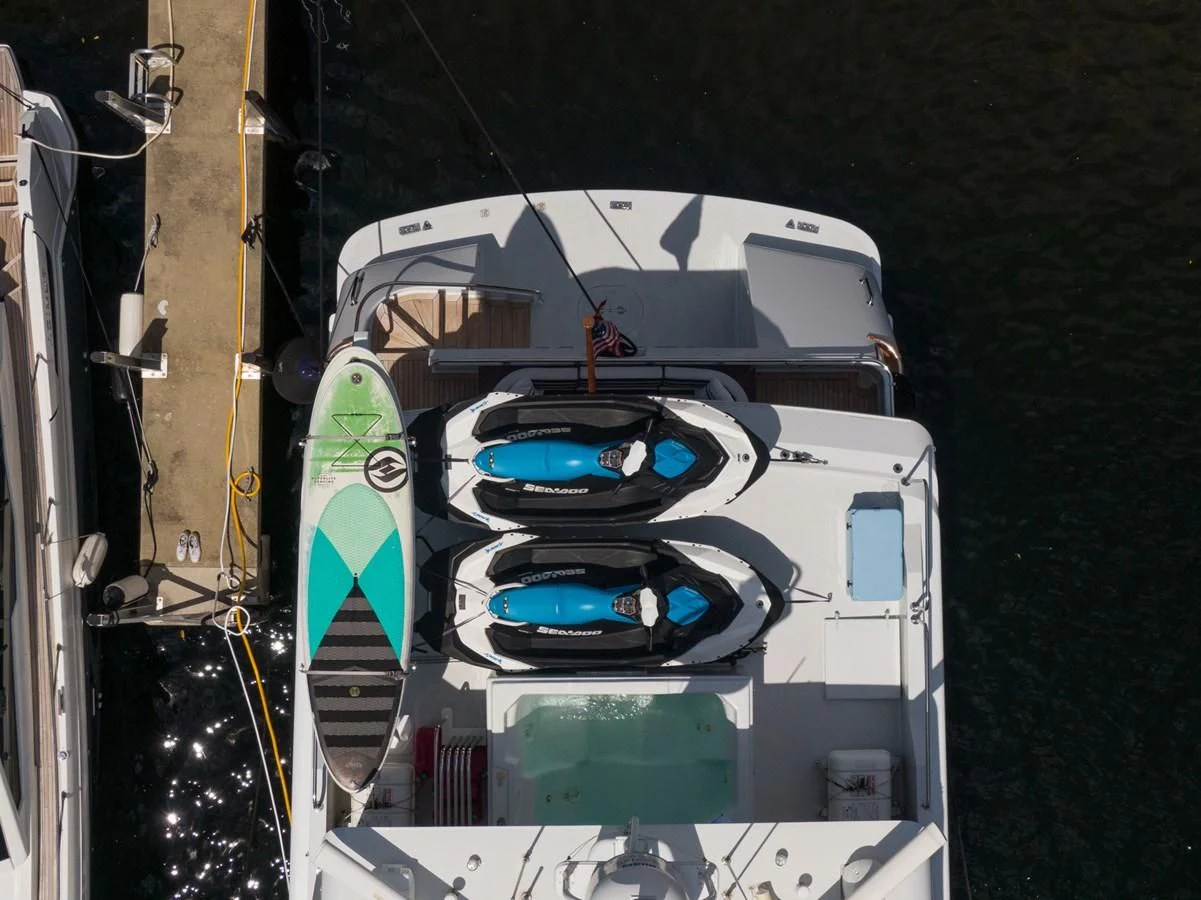 a white car with a blue and green interior aboard IMPULSE Yacht for Sale