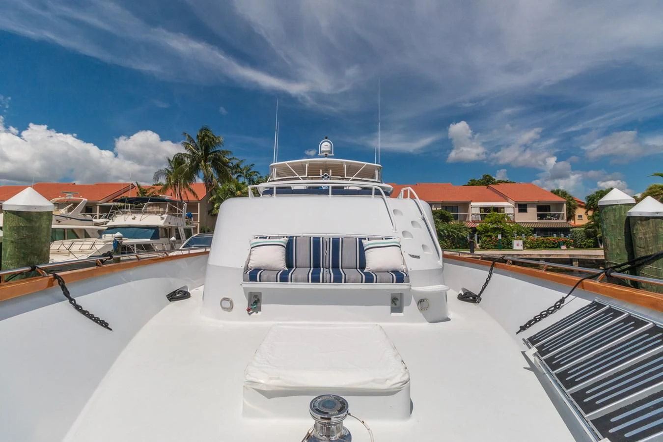 a white boat on a dock aboard IMPULSE Yacht for Sale
