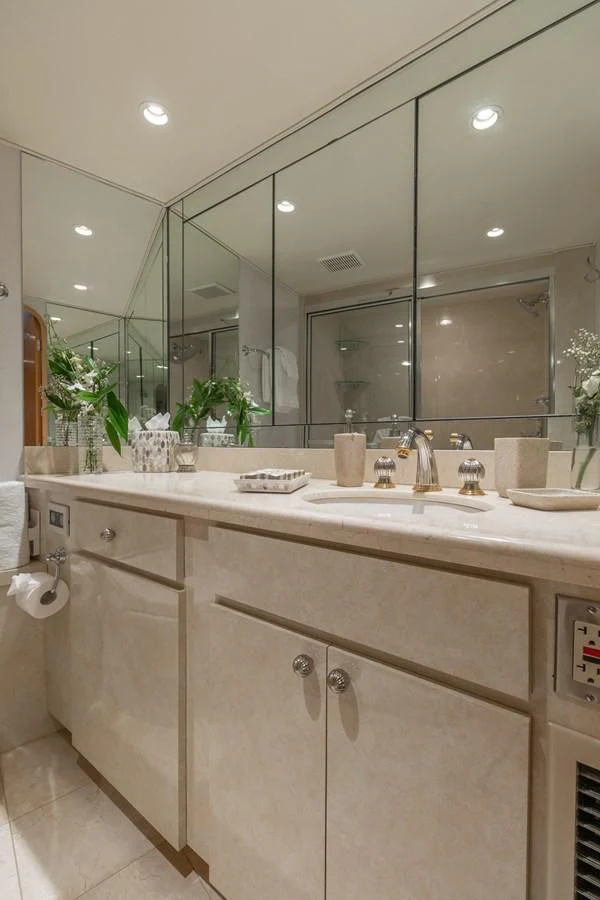 a bathroom with a large mirror aboard IMPULSE Yacht for Sale
