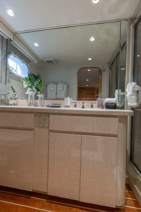 a bathroom with a large mirror aboard IMPULSE Yacht for Sale