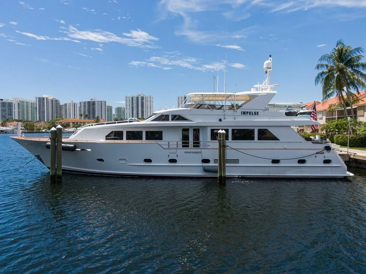 a white boat in the water aboard IMPULSE Yacht for Sale