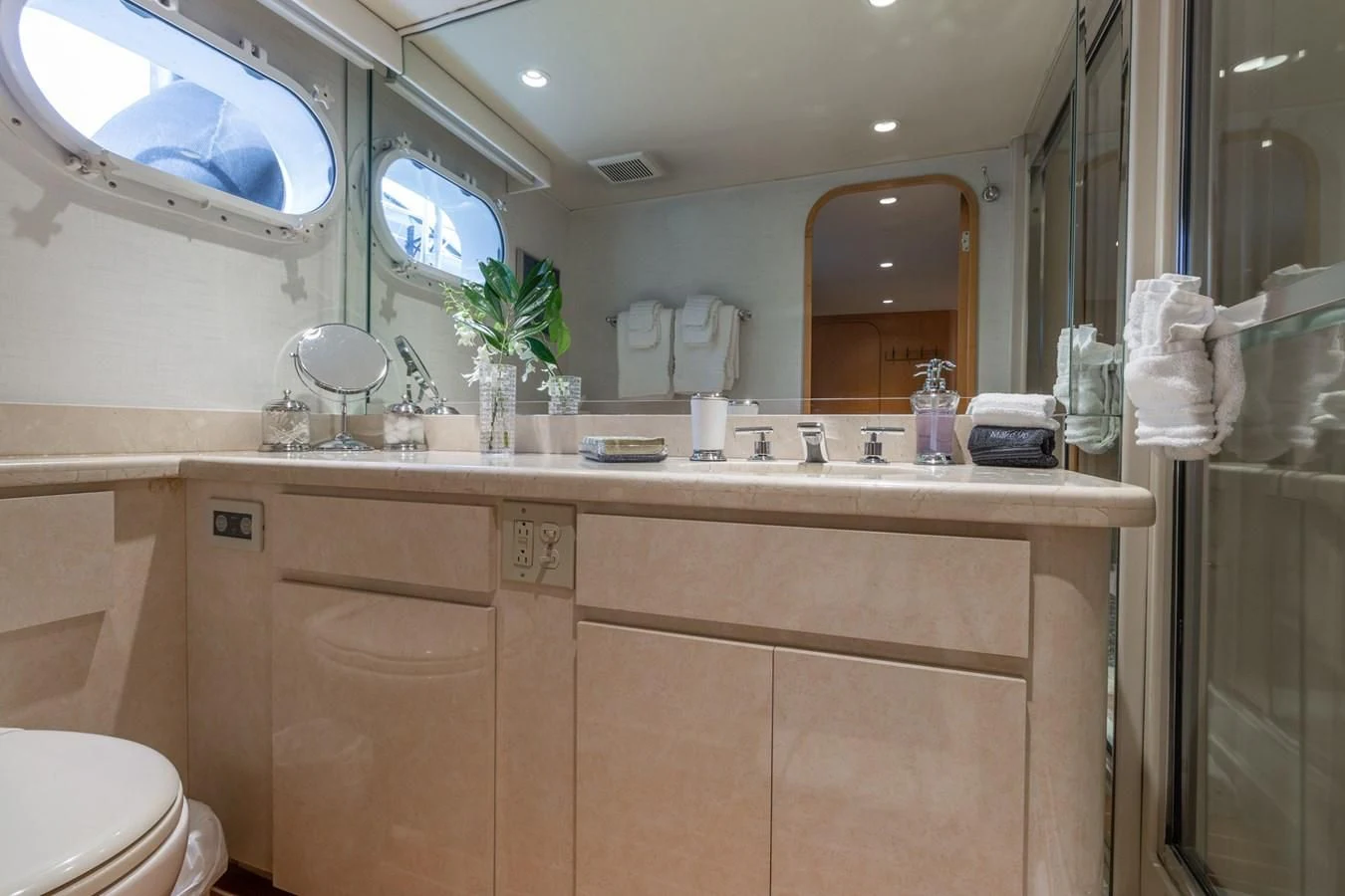 a bathroom with a large mirror aboard IMPULSE Yacht for Sale
