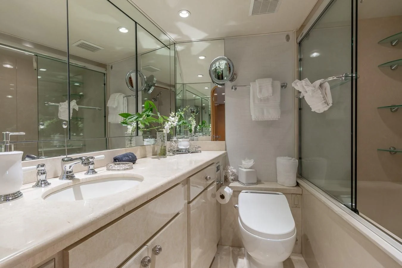a bathroom with a toilet and a sink aboard IMPULSE Yacht for Sale