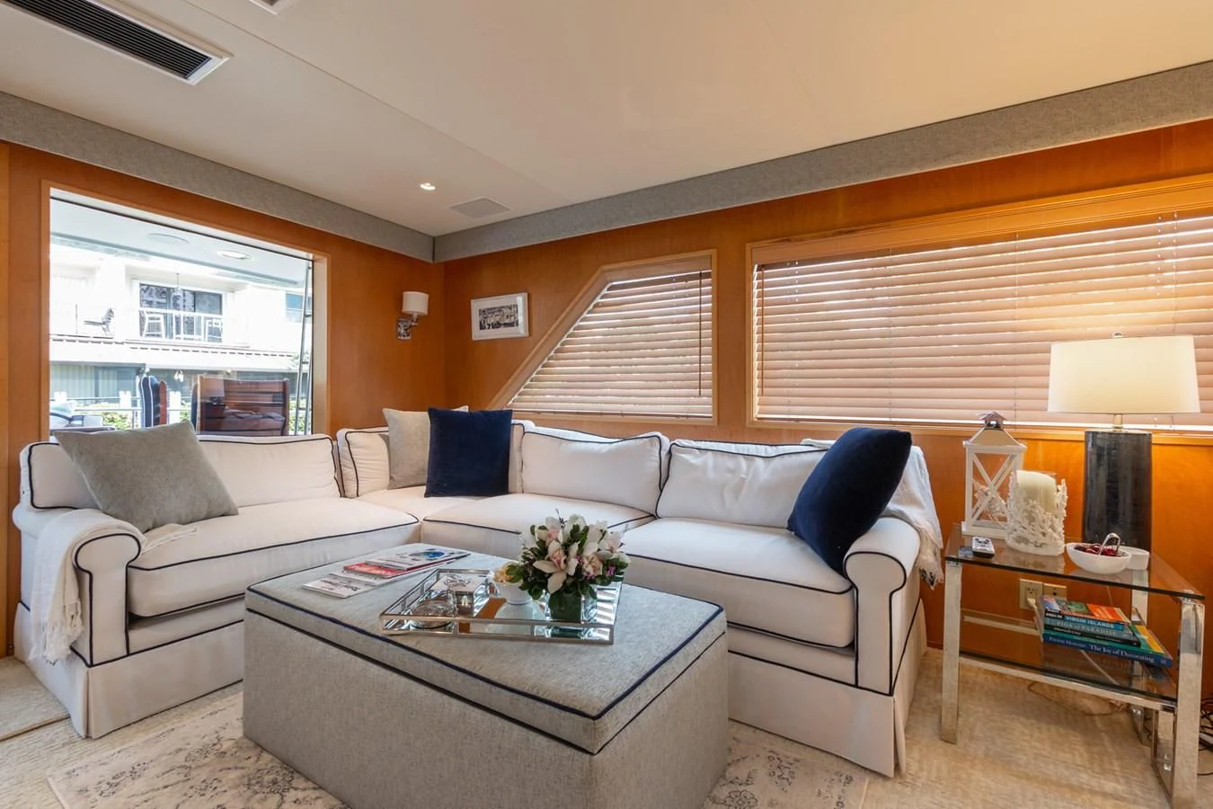 a living room with a couch and a coffee table aboard IMPULSE Yacht for Sale