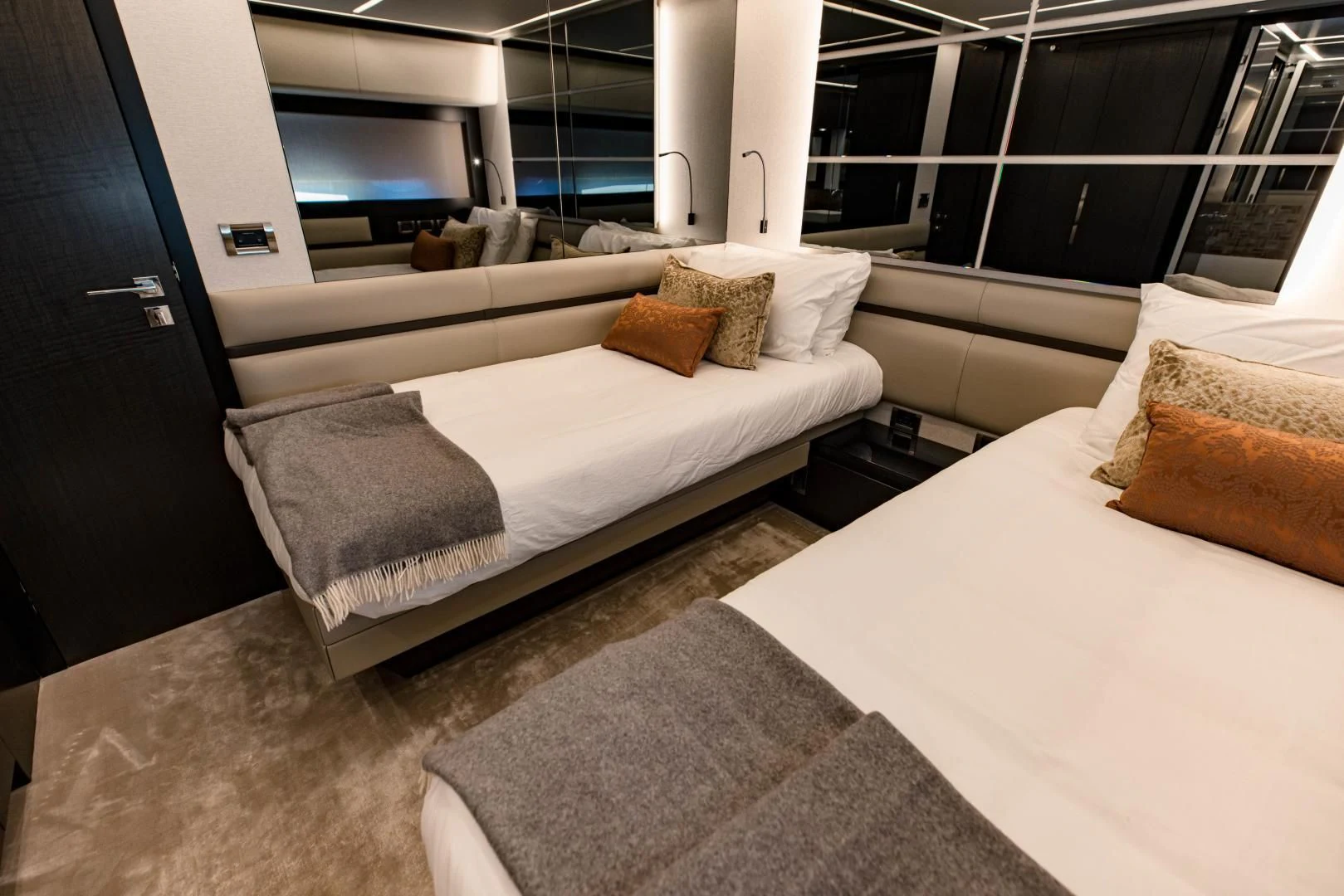a room with a bed and a tv aboard STALLION Yacht for Sale