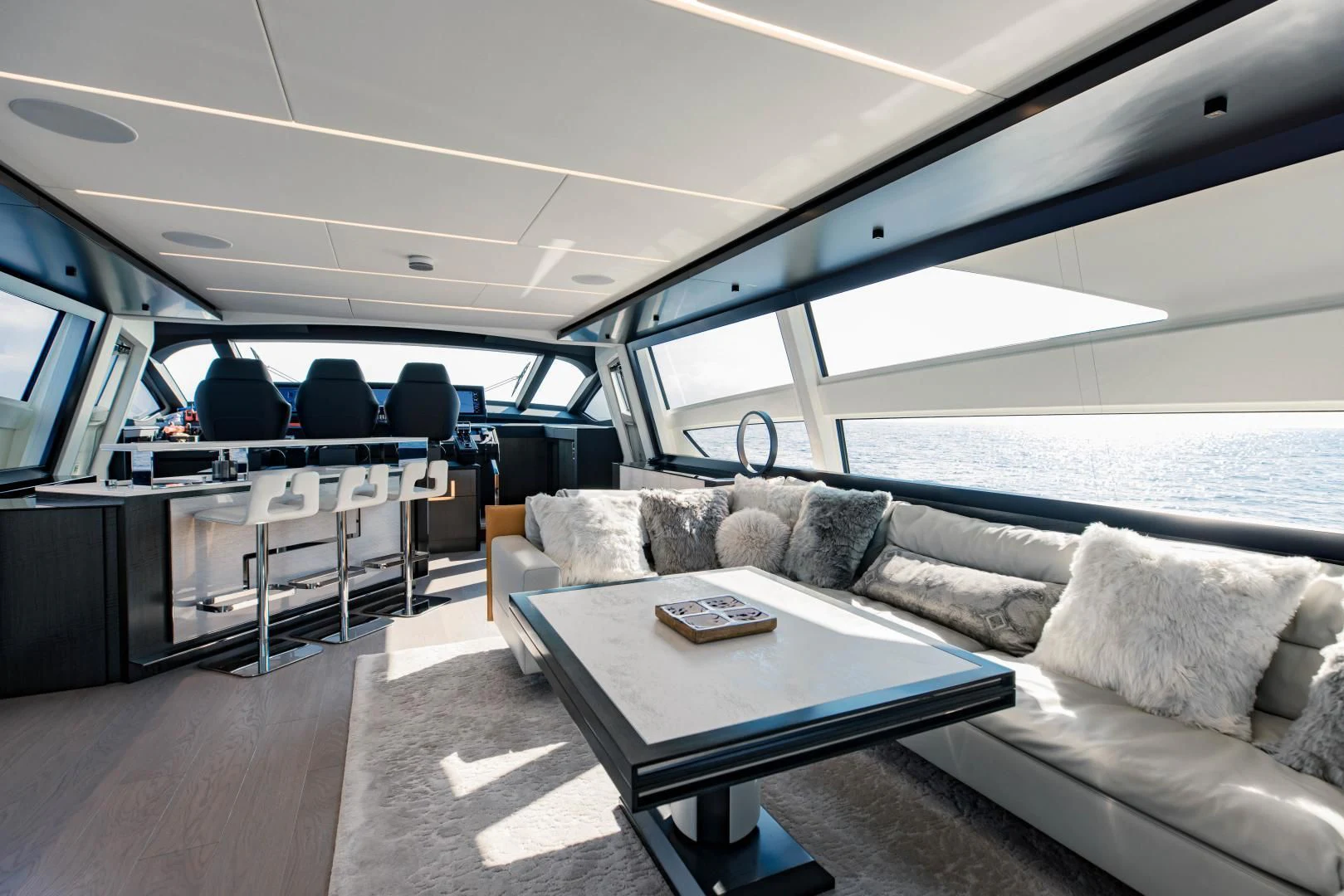 a boat with a couch and a table aboard STALLION Yacht for Sale