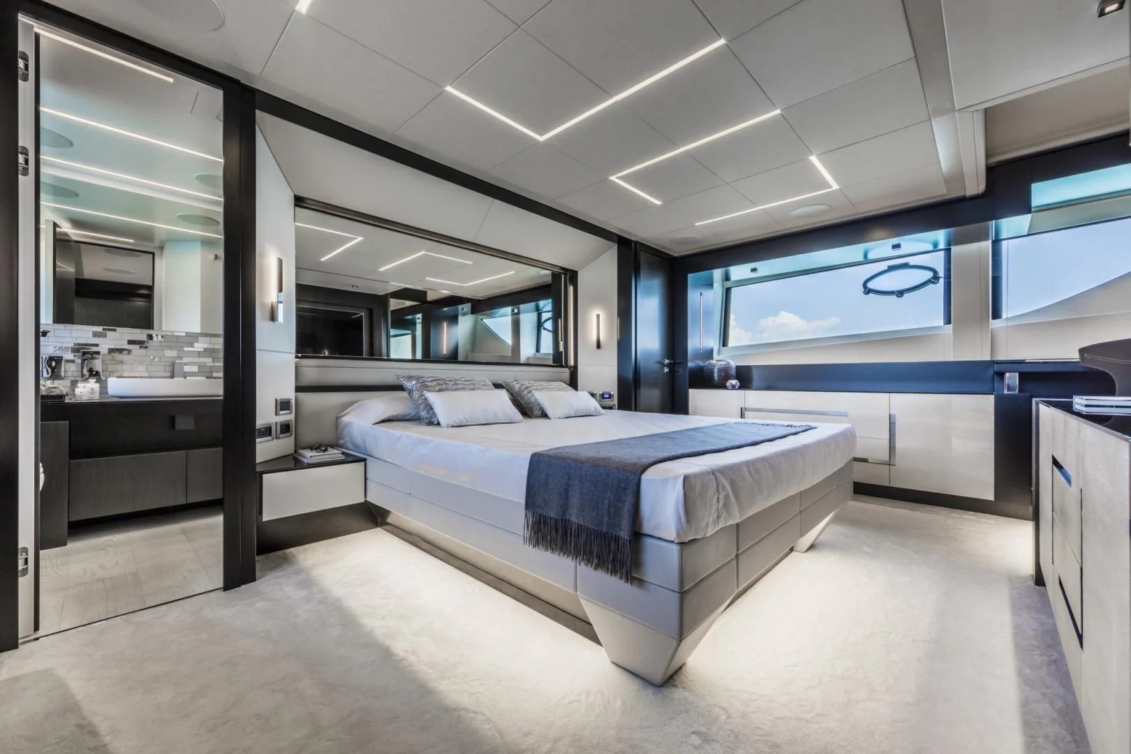 a room with a bed and a desk aboard STALLION Yacht for Sale