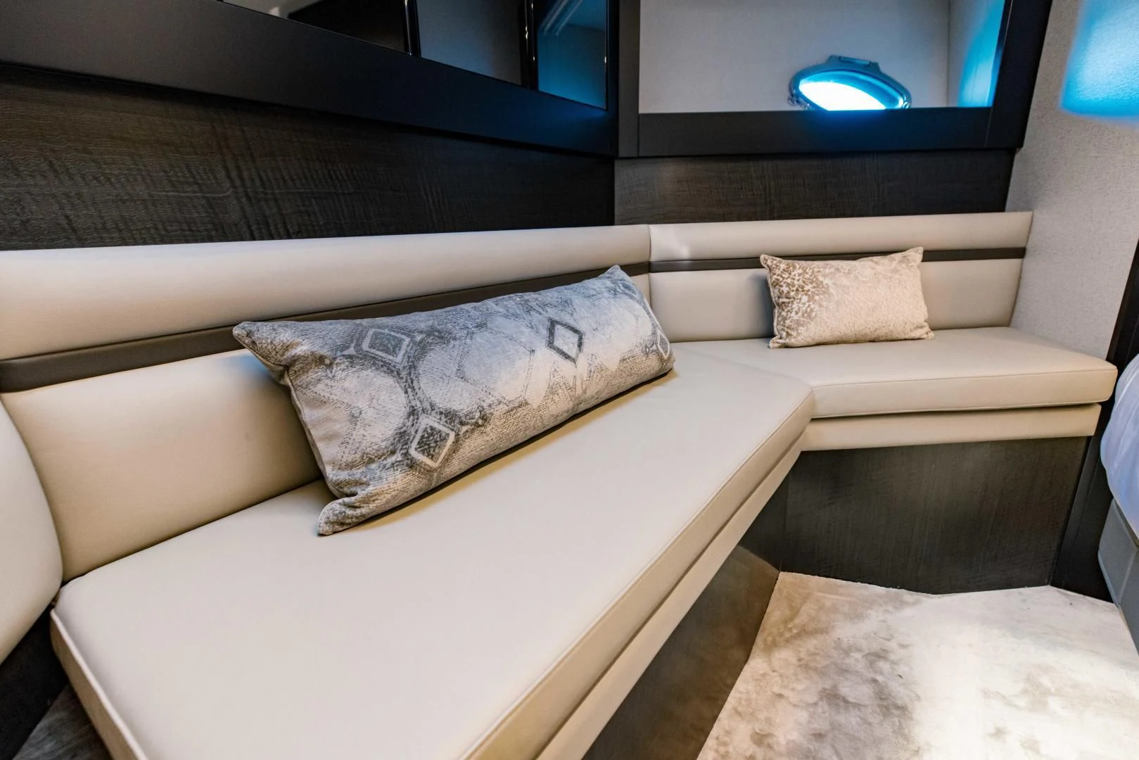 a couch with pillows aboard STALLION Yacht for Sale