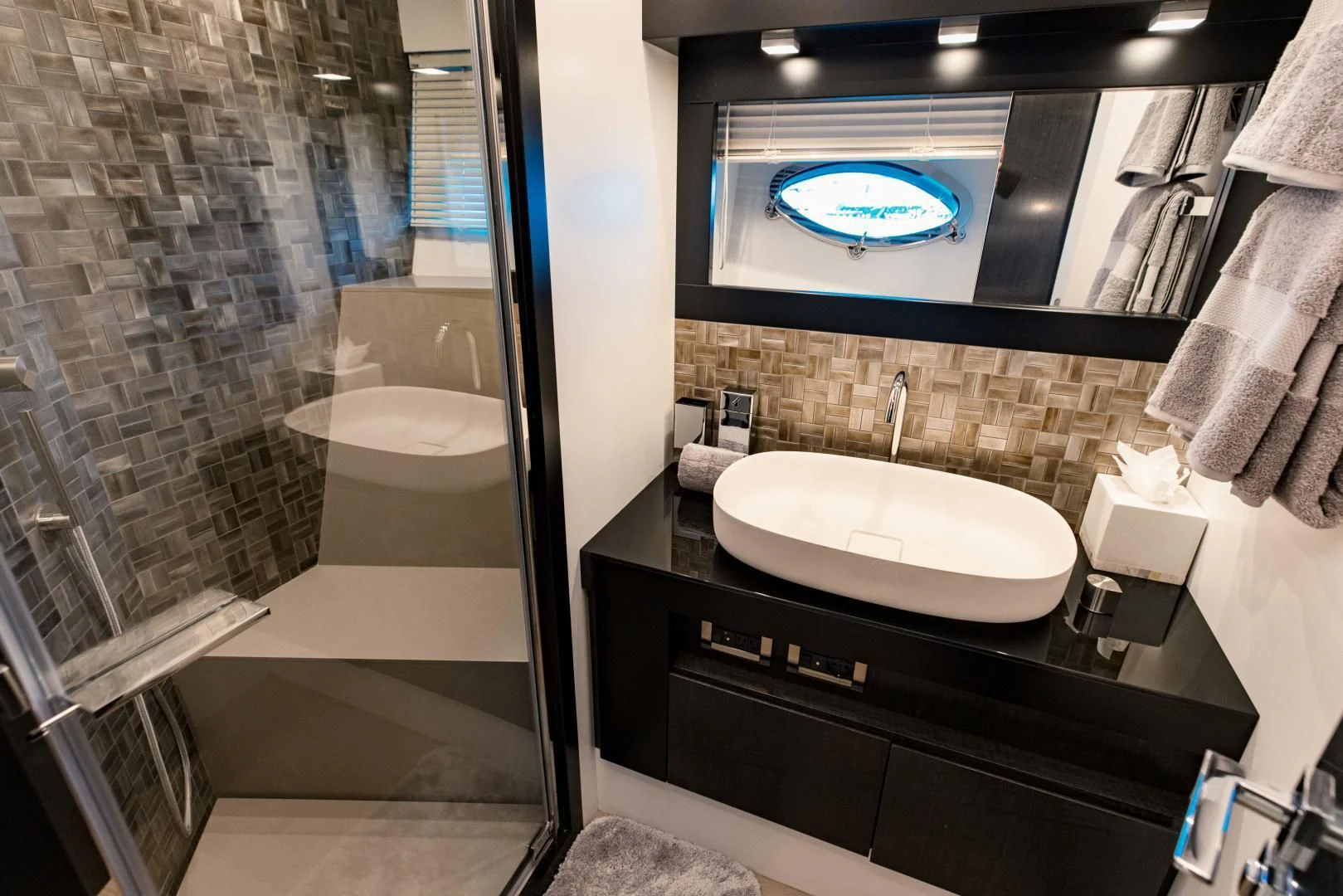 a bathroom with a large mirror aboard STALLION Yacht for Sale