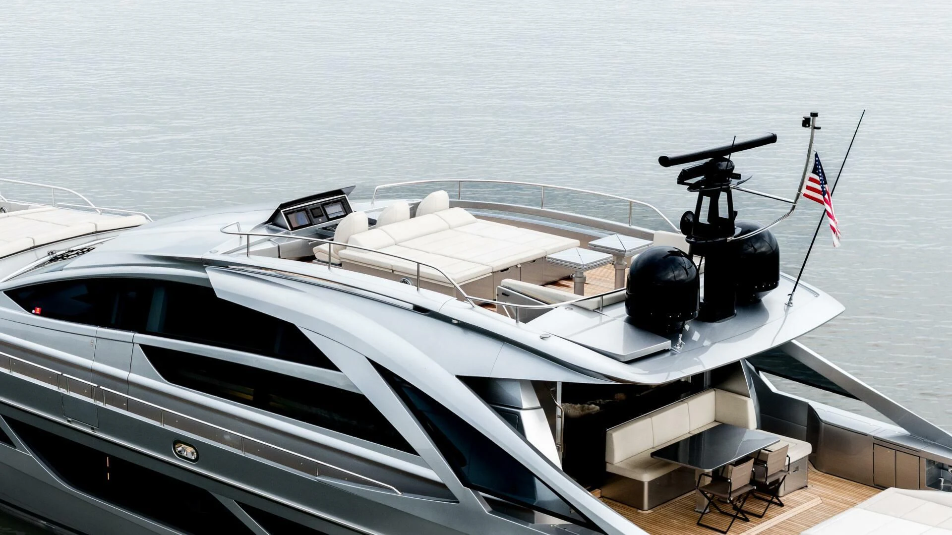 a white yacht with a gun on the deck aboard STALLION Yacht for Sale