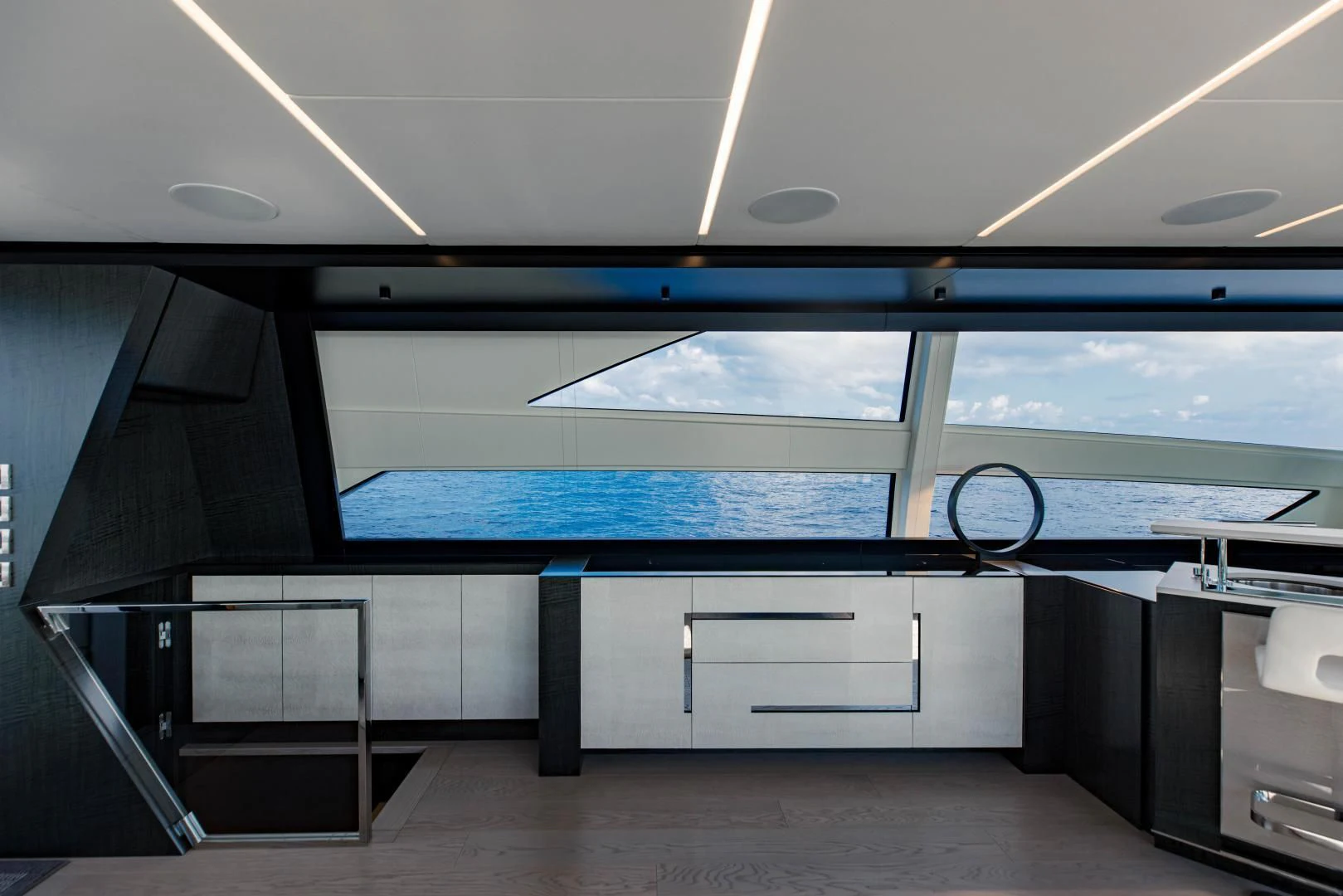 a room with a large window and a large blue pool table aboard STALLION Yacht for Sale