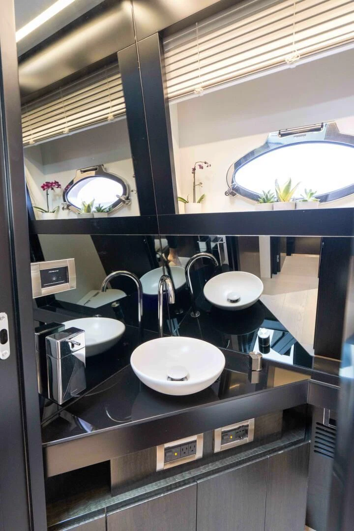 a kitchen with sinks and mirrors aboard STALLION Yacht for Sale