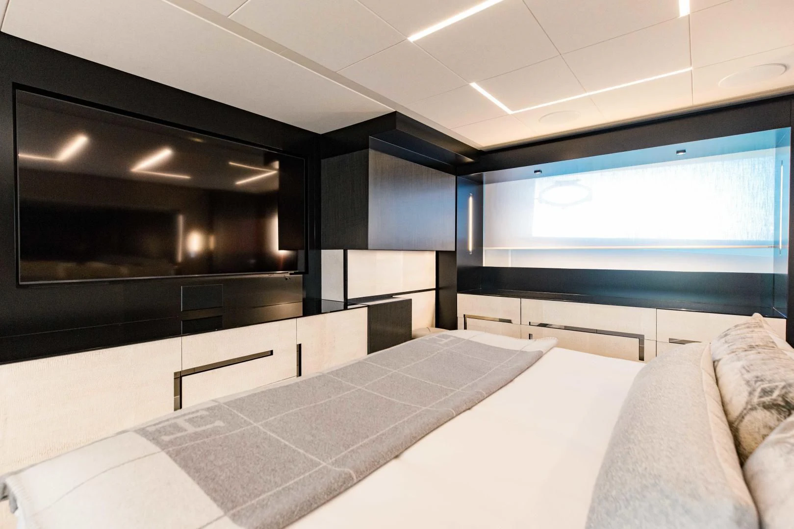 a room with a bed and a tv aboard STALLION Yacht for Sale