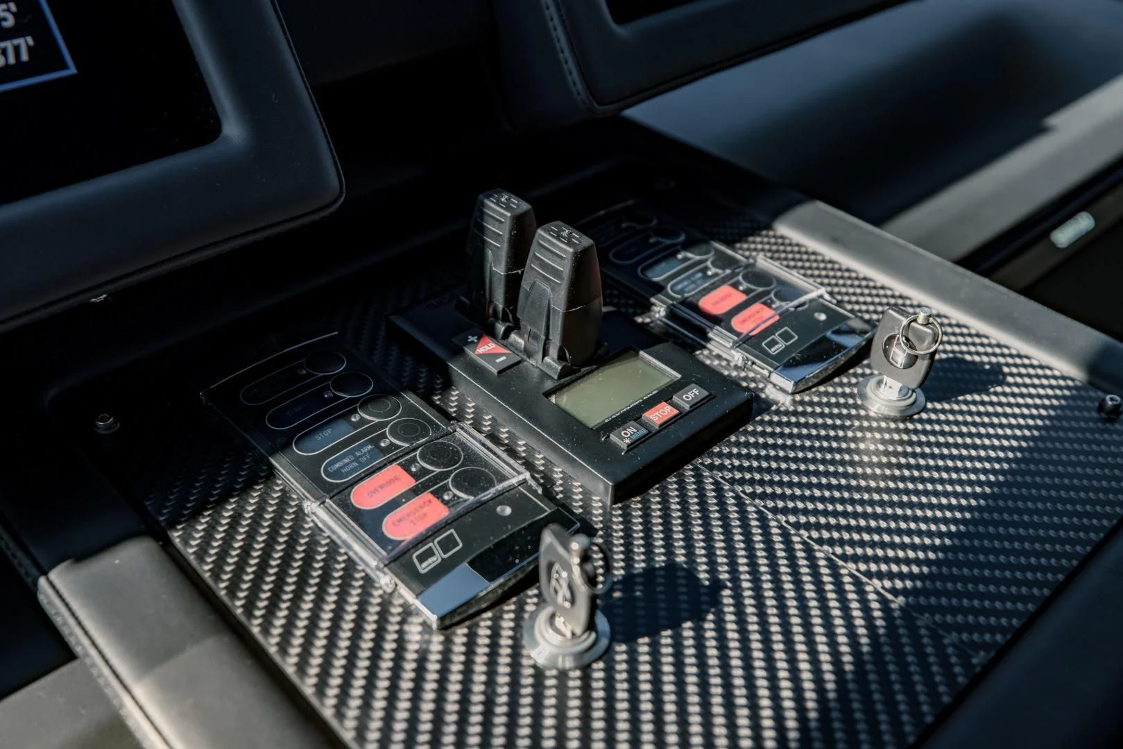 a black car with a black hood aboard STALLION Yacht for Sale