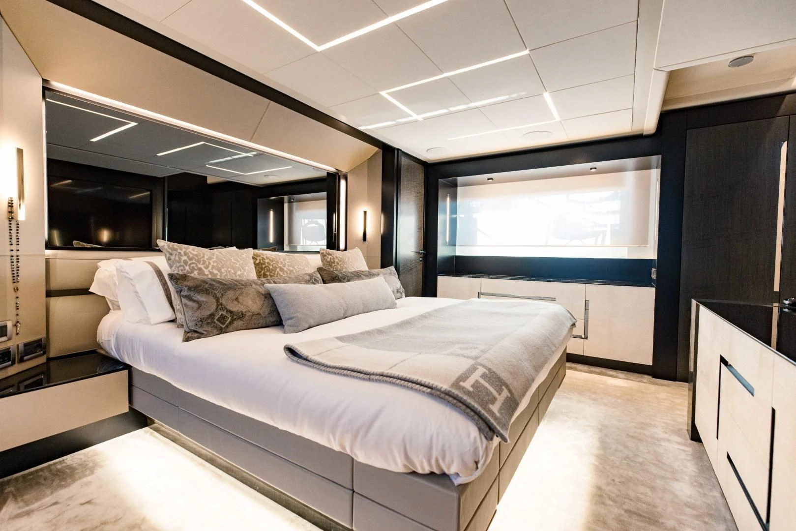 a bedroom with a large bed aboard STALLION Yacht for Sale