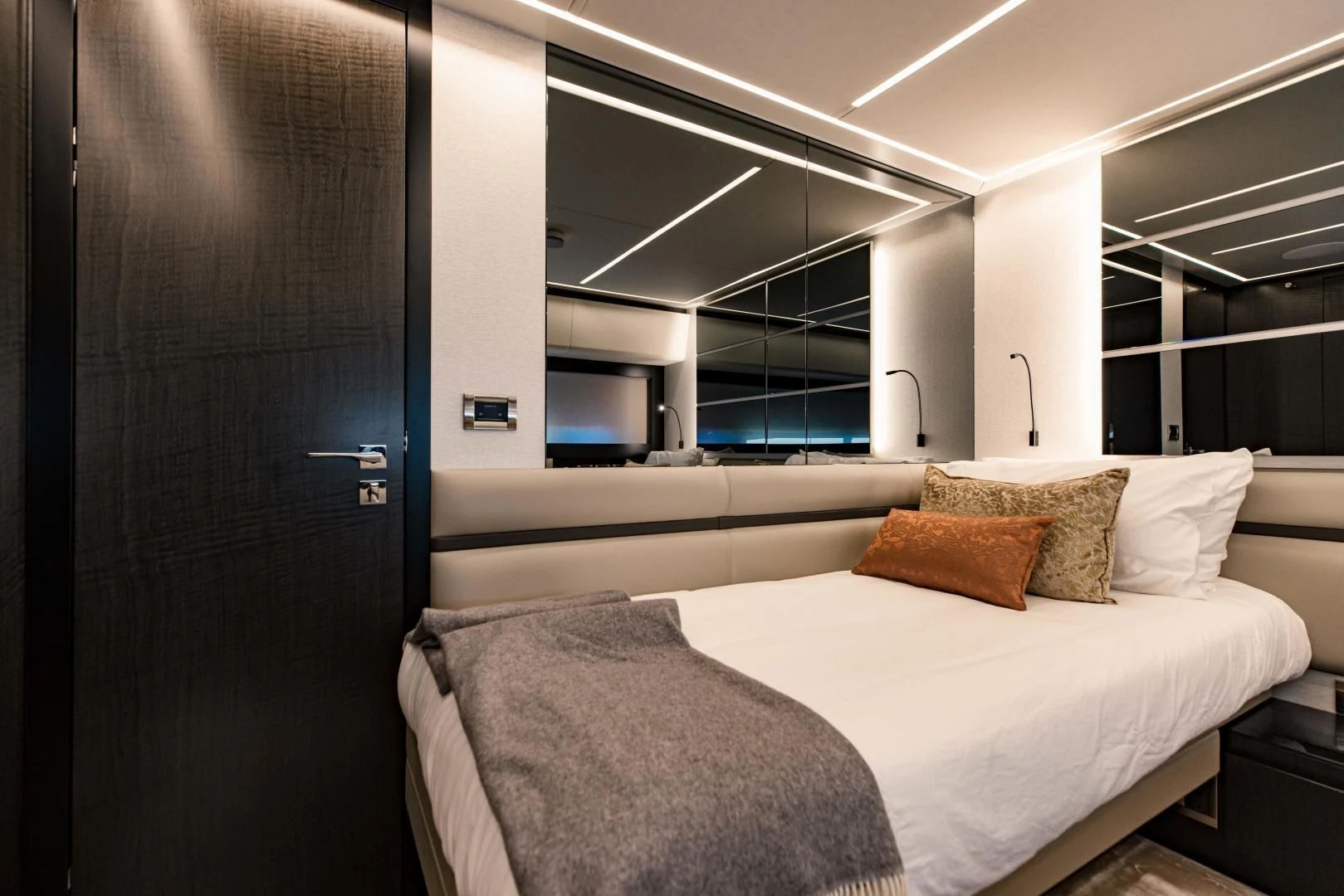 a room with a bed and a window aboard STALLION Yacht for Sale