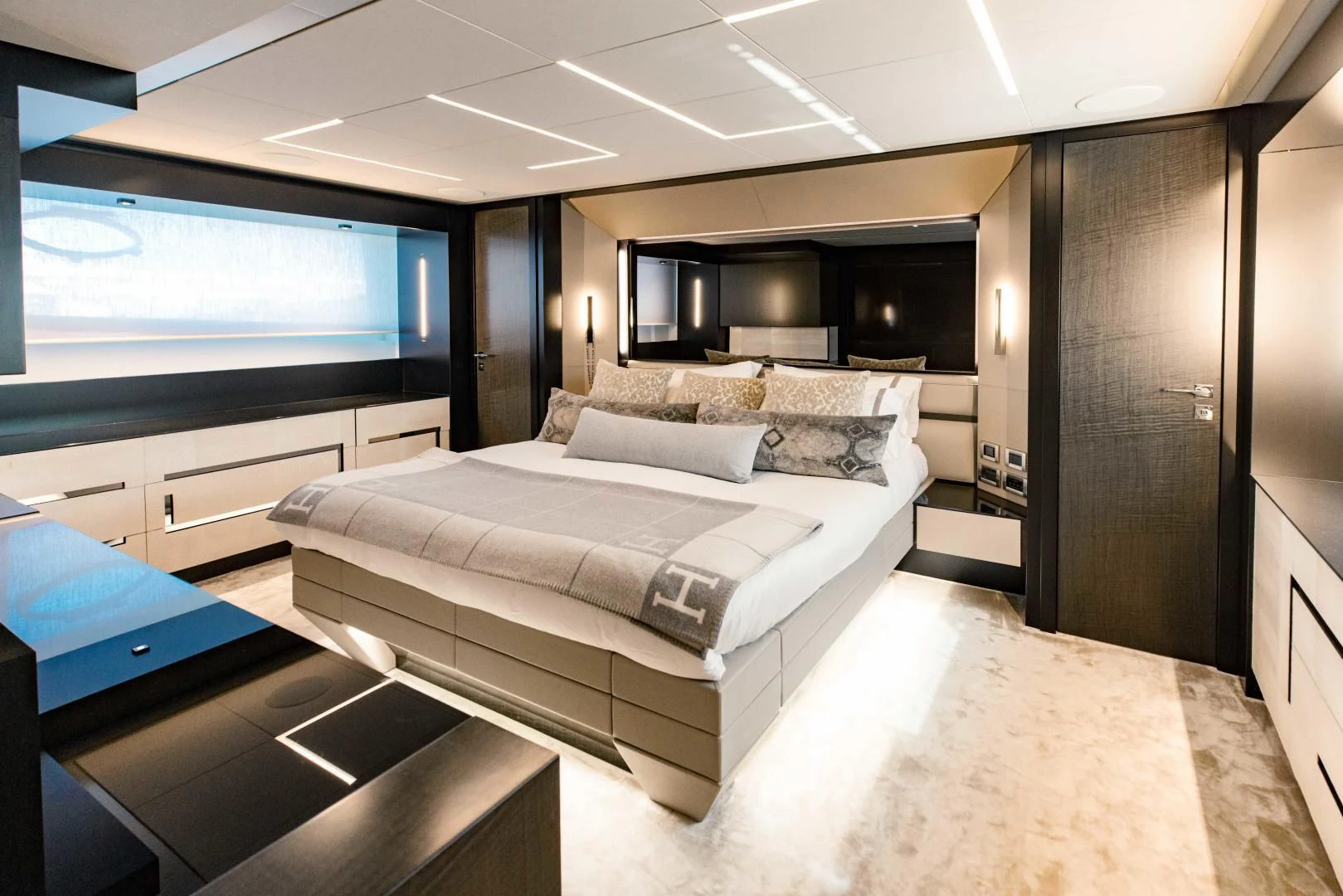 a room with a bed and a couch aboard STALLION Yacht for Sale