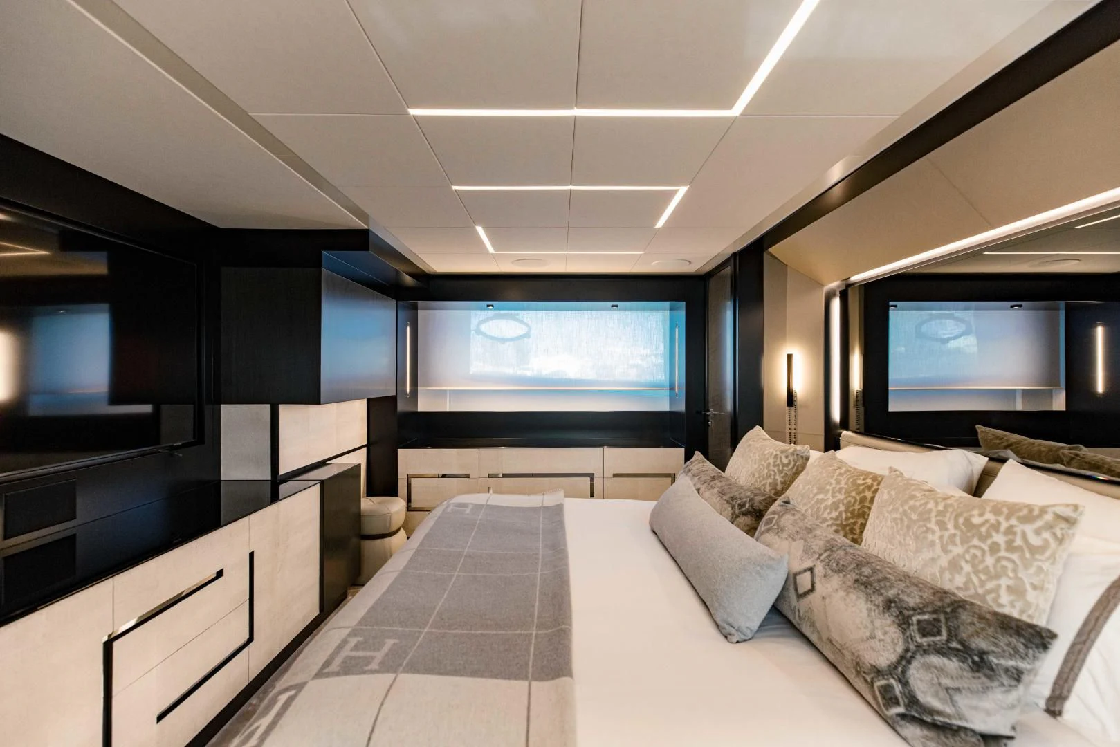 a room with a bed and a tv aboard STALLION Yacht for Sale