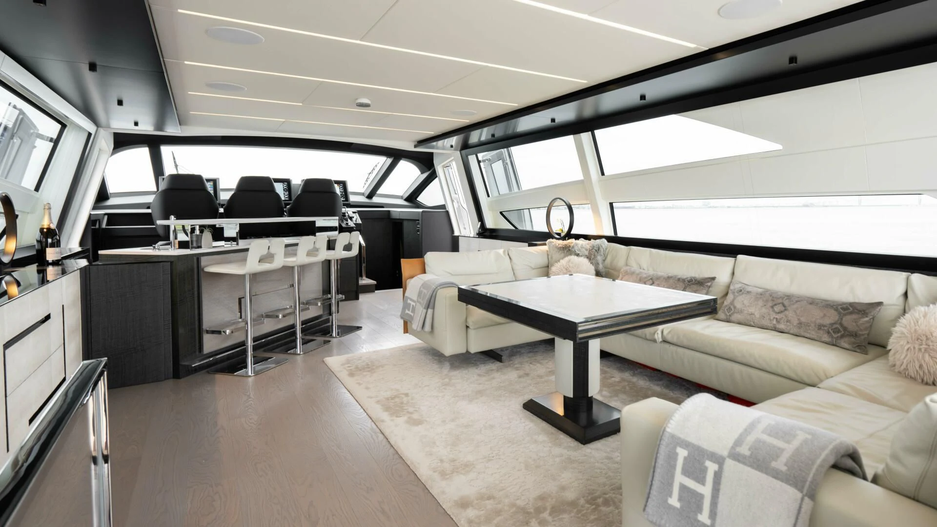 a living room with a couch and a table aboard STALLION Yacht for Sale