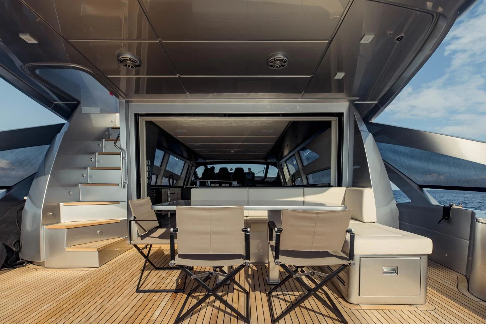 a room with a table chairs and a large window aboard STALLION Yacht for Sale
