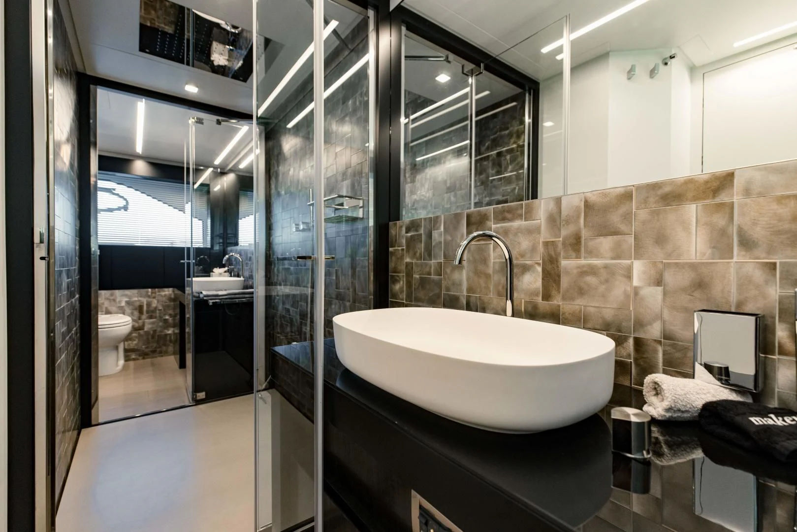 a bathroom with a large glass shower aboard STALLION Yacht for Sale