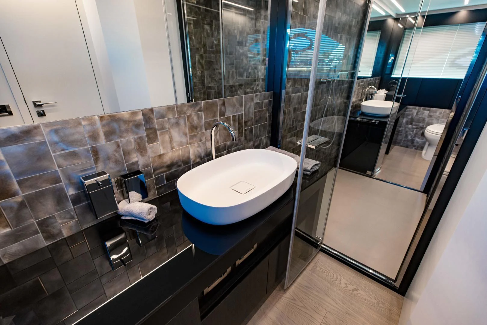 a bathroom with a sink and a shower aboard STALLION Yacht for Sale