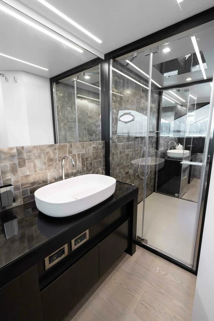 a bathroom with a sink and a mirror aboard STALLION Yacht for Sale