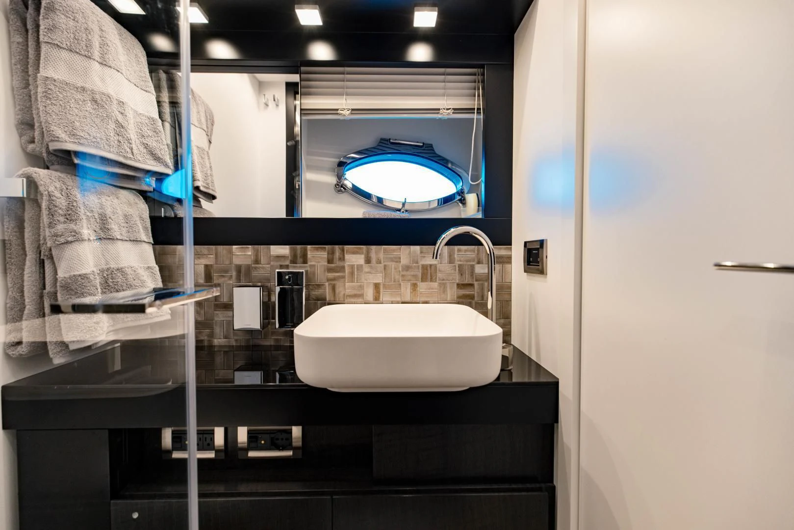 a bathroom with a sink and a mirror aboard STALLION Yacht for Sale