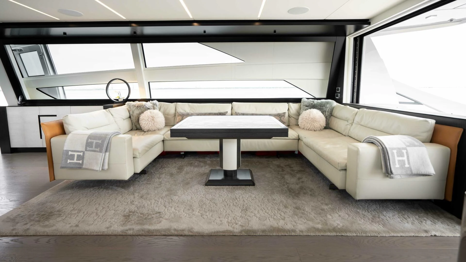 a living room with a couch and a coffee table aboard STALLION Yacht for Sale