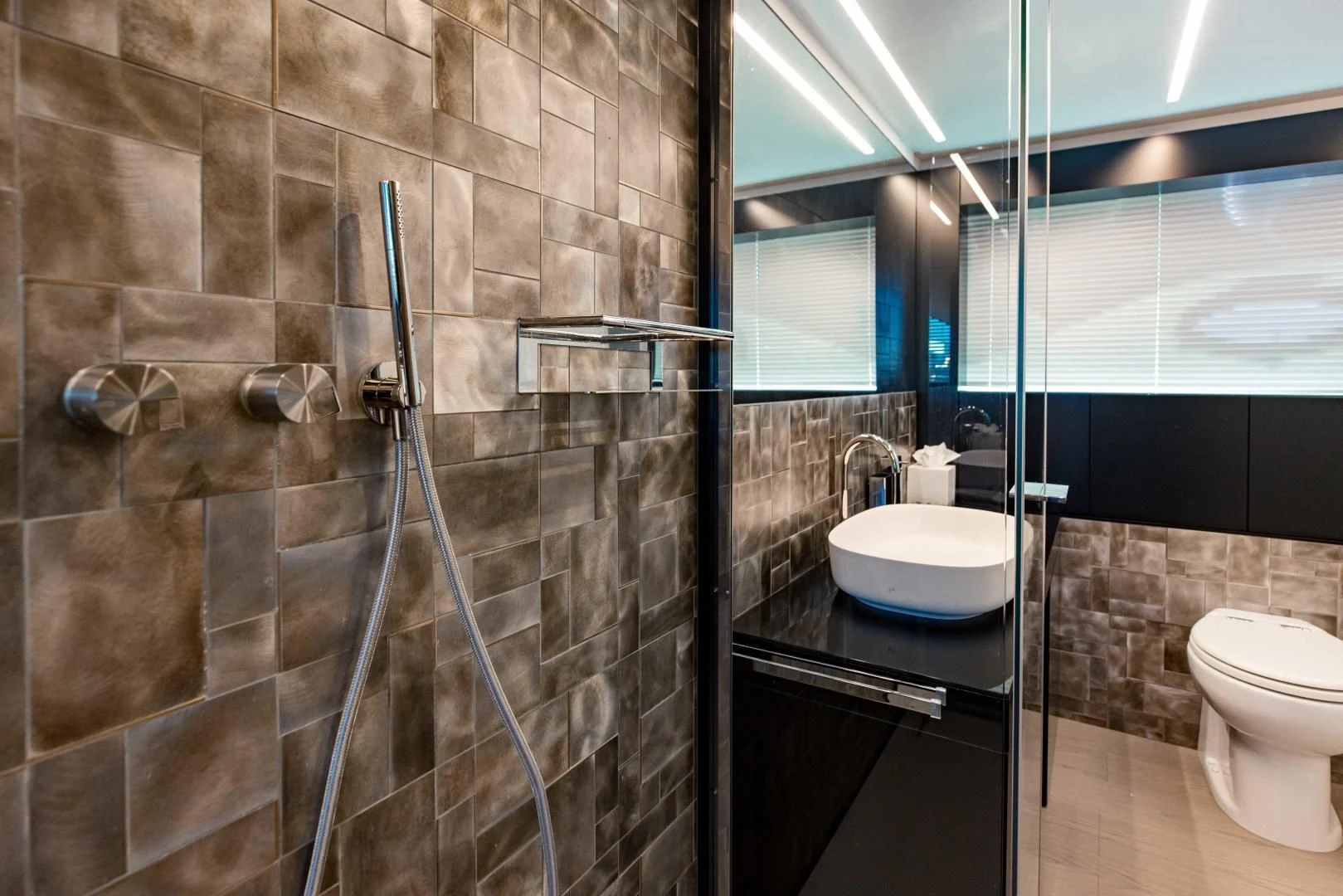 a bathroom with a glass shower aboard STALLION Yacht for Sale