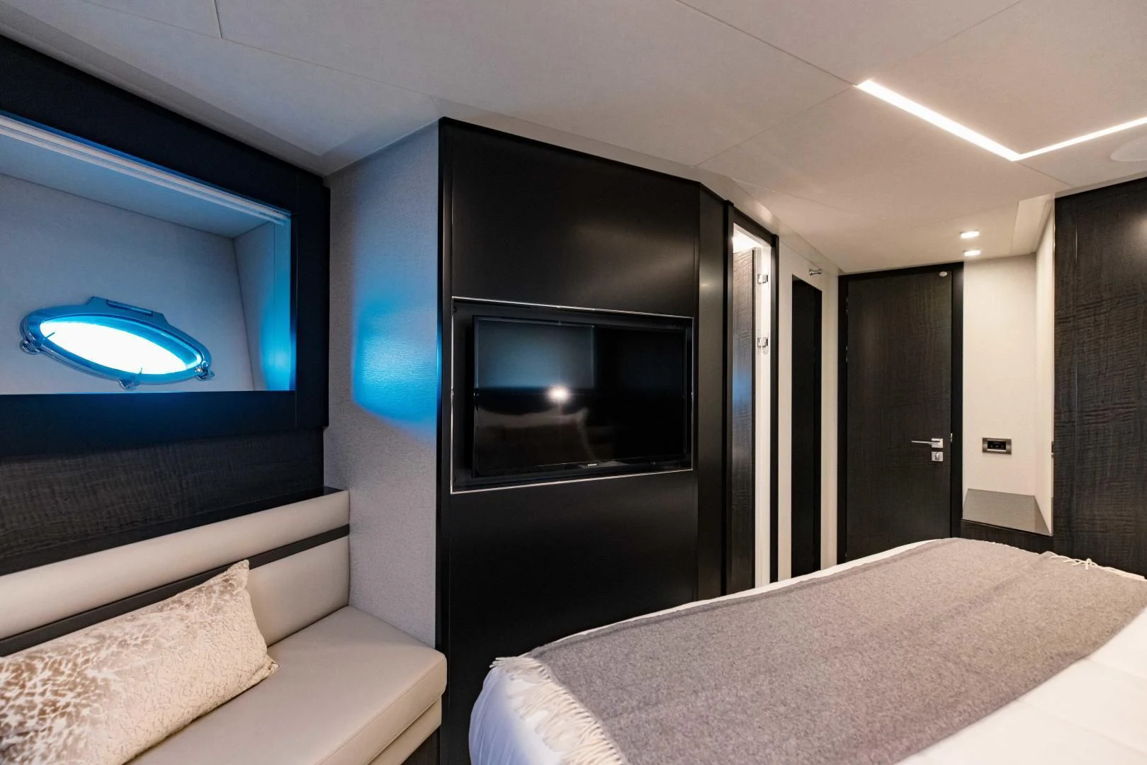 a bedroom with a large tv aboard STALLION Yacht for Sale
