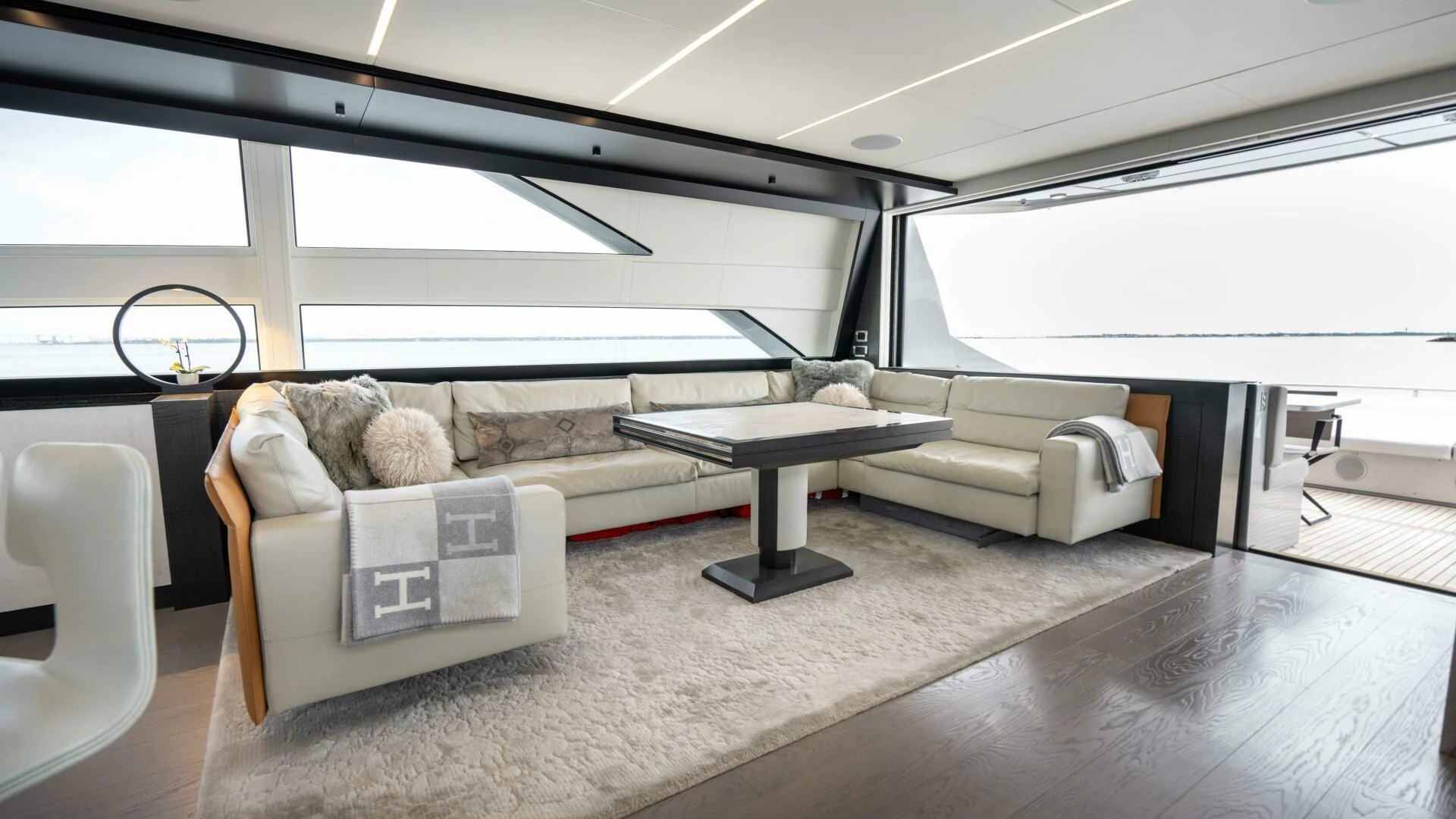 a room with couches and a table aboard STALLION Yacht for Sale