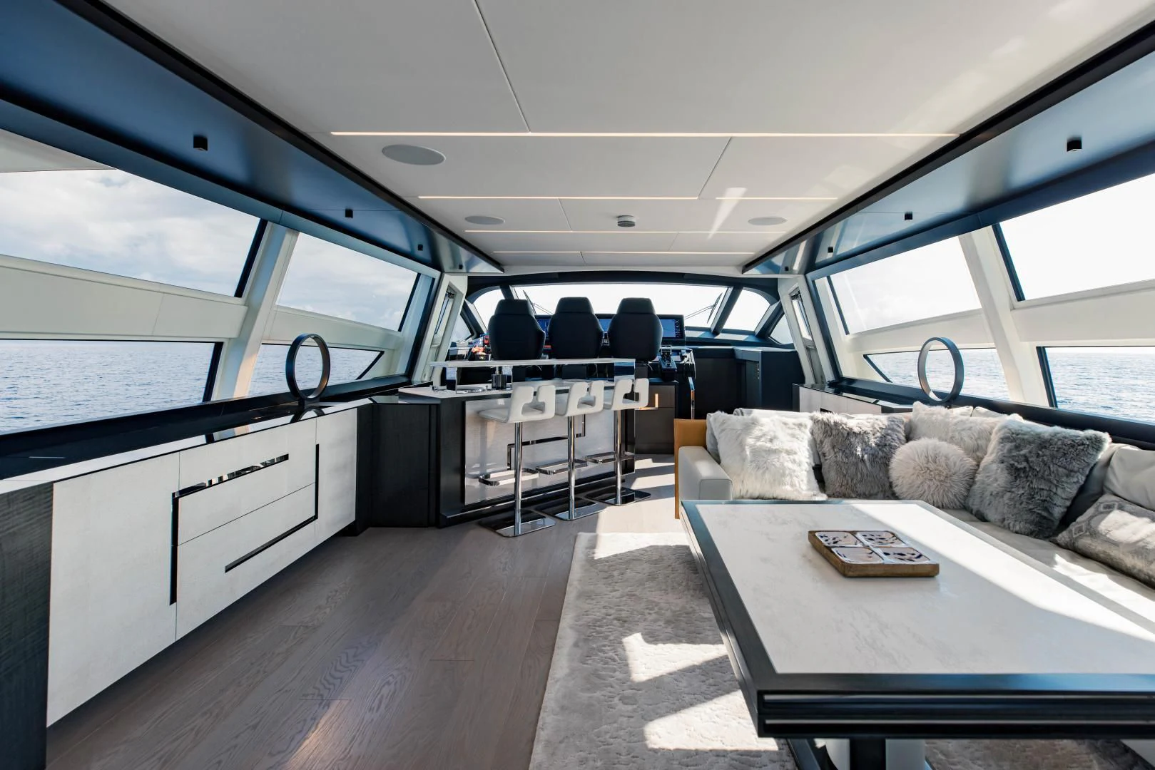 a vehicle with a couch and a table and chairs aboard STALLION Yacht for Sale
